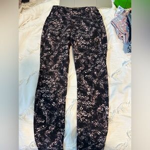 Calia by Carie Underwood leggings. Black and purple floral. Size extra small.